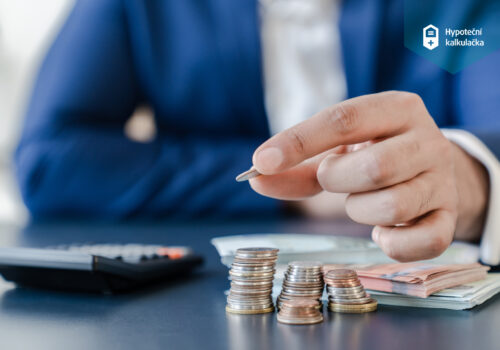 Businessman,Holding,Euro,Cents,Coins,Dollar,Bills,On,Table,With